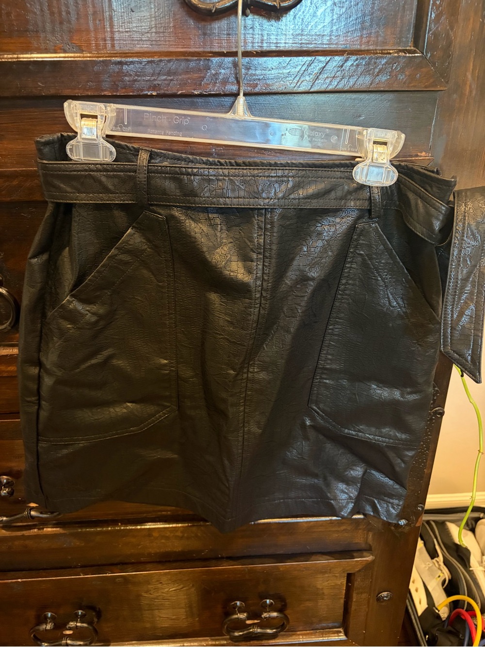 Shinestar Black Faux Leather Mini Skirt with Front Paneling